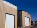 If you need multiple large buildings for your warehouse needs, Armor Steel Buildings can clone your designs to allow significant savings on the multiple building purchases.  These buildings show how you can add wall bands at the top for additional light while maintaining security of your property.